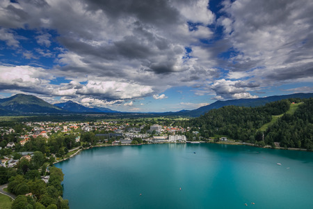 BLED, SLOVENIA - JULY 14, 2019: Aerial view of the Bled city resorts, hotels, houses, parks and beaches situated on the bank of the Bled lakeのeditorial素材