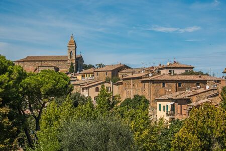 Sunny day over the roofs of the old town. Montalcino, Italyの写真素材