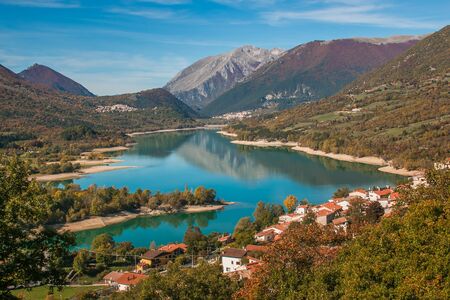 Beautiful lakes of Italy- turquoise Lago di Barrea and medieval village, Abruzzoの写真素材