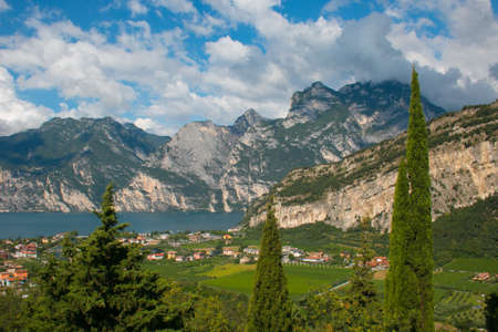 The panorama of Riva del Garda and Lago di Garda lake on summer day in Trentinoの写真素材