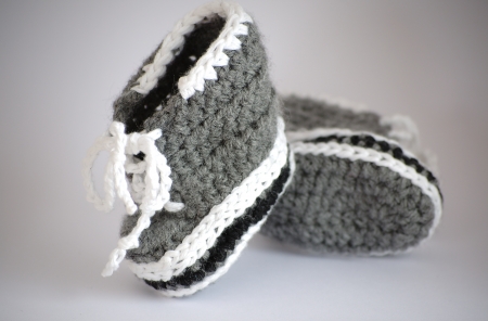 Handmade knitted baby booteesの写真素材