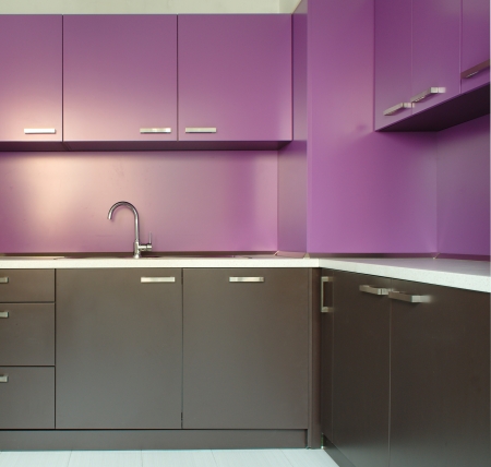 Newly fitted modern kitchen in purple and brownの写真素材