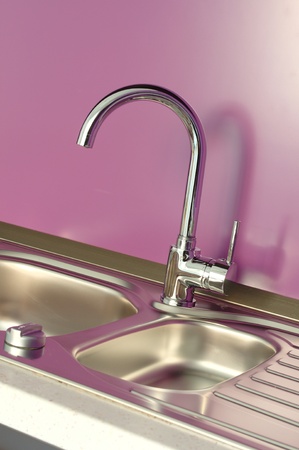 Newly fitted modern kitchen in purple and brownの写真素材