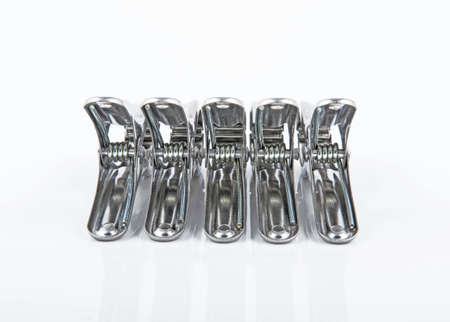 Stainless clothespin on white backgroundの写真素材