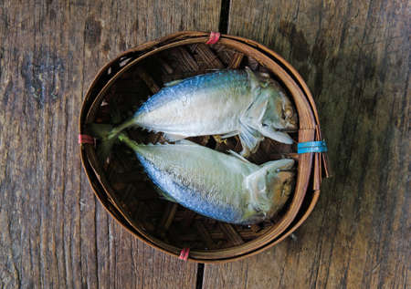 Steamed Mackerel fish on bamboo wicker basketの写真素材