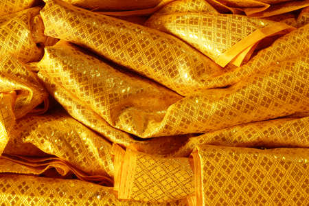 Golden color ancient textile texture for backgroundの写真素材
