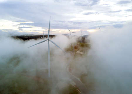 Wind turbines farmland for generating electricity in Southeast Asia.の写真素材