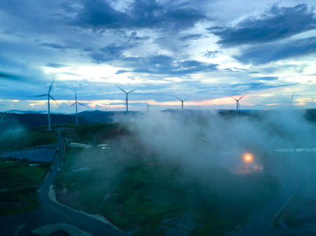 Wind turbines farmland for generating electricity in Southeast Asia.の写真素材