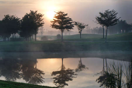 Golf course with foggy in the morning.の写真素材