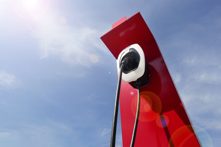 Charging station for electric cars on the background of the blue skyの写真素材