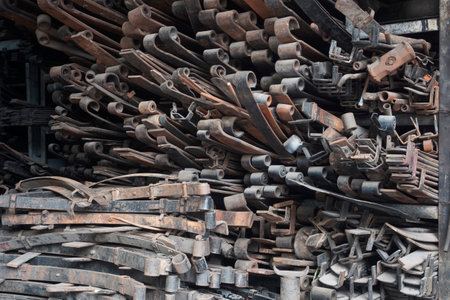 A lot of old rusty railway sleepers in a metal workshop.の写真素材