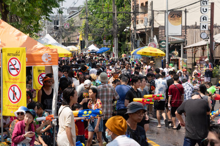CHIANG MAI - APRIL 13, 2024 ; Songkran Festival is celebrated in a traditional. People enjoy...