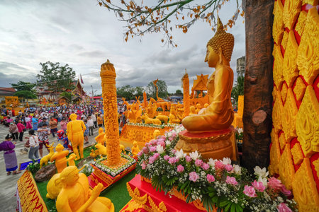 LAMPHUN, THAILAND - JULY 20, 2024 : The only candle procession tradition beautiful performances of wisdom in northern Thailand.のeditorial素材