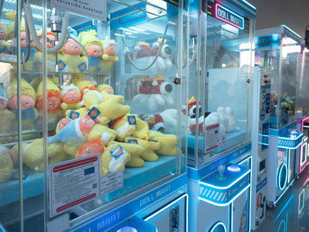 THAILAND - CHIANG-MAI, 10 MARCH 2025 : Doll Catching Cabinet has to use crane to pick the target toy in Chiang Mai market.の写真素材