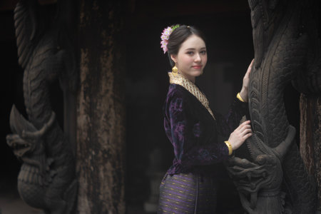 Beautiful young Asean woman in traditional Thai Dvaravati dress in an old temple in Chiang Mai, Thailand.の写真素材