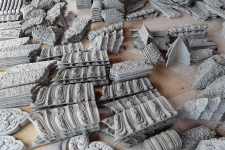 Thai pattern sculpture is beautiful made of cement with handmade and attach to the wall in temple.の写真素材