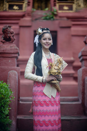 Beautiful Asian women holding a traditional paper lantern during Yi peng lantern festival at Wat...