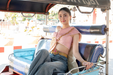 Beautiful young women wear Contemporary Thai dresses with jeans as a fashion trend in Chiang Mai.の写真素材