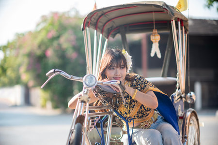 Beautiful young women wear Contemporary Thai dresses with jeans as a fashion trend in Chiang Mai.
