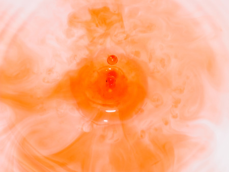 red water drop on the plateの写真素材