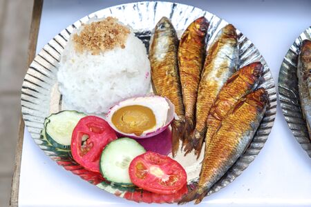 Filipino food - Fried fish with riceの写真素材