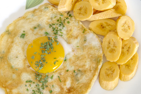 sunny side up egg with bananaの写真素材