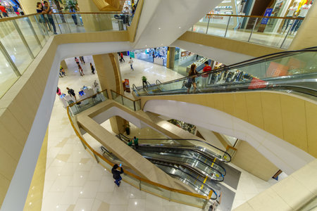Feb 20,2018 Guests on a shopping Up town mall escalator, Taguig City, Philippinesのeditorial素材