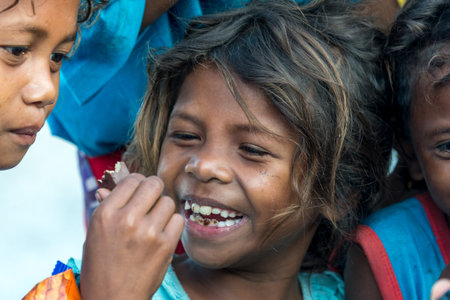 Feb 18, 2018 Aeta child happy to eat chocolate bar, Capas, Philippinesのeditorial素材