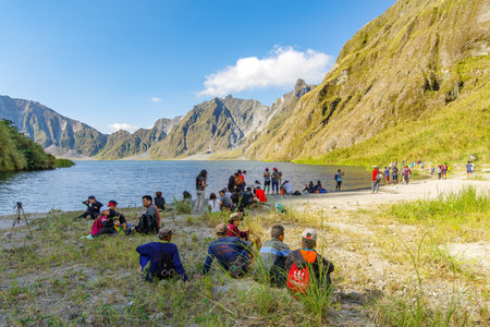 Feb 18,2018 Tourists and guides taking a break in front of Mt. Pinatubo crater lake, Capas, Philippinesのeditorial素材