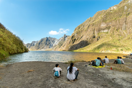 Feb 18,2018 Tourists and guides taking a break in front of Mt. Pinatubo crater lake, Capas, Philippinesのeditorial素材
