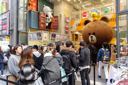 Mar 18,2018 Tourist taking photo with character at Myeongdong shopping street, Seoul, Koreaのeditorial素材