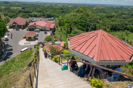 Bohol island, Philippines. Apr 23, 2018 : Tourists climbing on the Chocolate Hill Observatoryのeditorial素材