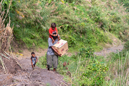 CAPAS , PHILIPPINES - July 8, 2018 : Aeta people going to town with their luggageのeditorial素材