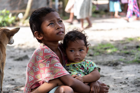 CAPAS , PHILIPPINES - July 8, 2018 : Aeta boy holding his brotherのeditorial素材