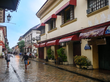 Aug 24,2018 Vigan City, Philippines - People who walk in downtown Vigan on rainy daysのeditorial素材