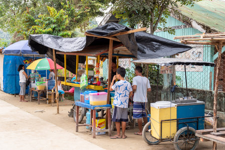 Dec 22,2018 A child who bought a snack at a store, Palawan, Philippinesのeditorial素材