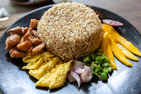 Thai style fried rice on the black plateの写真素材