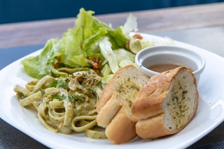 oil base spaghetti with garlic bread and Salad, Philippinesの写真素材