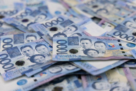 A pile of one thousand Philippines banknotes. Cash of Thousand dollar bills, Peso background image.の写真素材