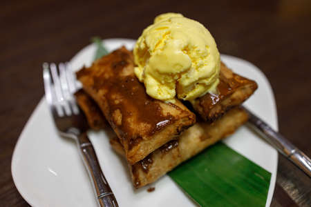 Filipino Desert Leche Flan with Ice cream at White dish