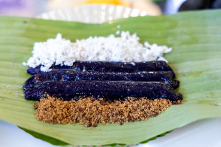 Philippines traditional street food Puto Puto bumbong on the banana leafの写真素材