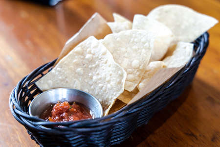 Salsa Sauce and Nachos at Restaurantの写真素材
