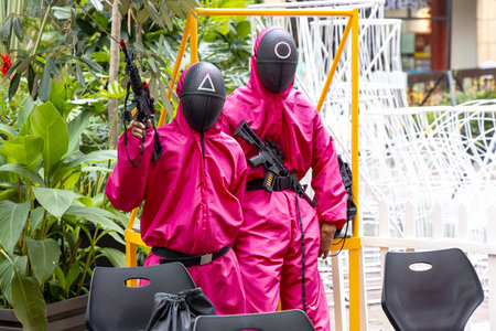 People who enjoy Squid game event at the Eastwood Shopping Mall, Metro Manila, Philippines, Oct 31, 2021のeditorial素材