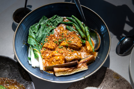 Kare-kare is a Philippine stew that features a thick savory peanut sauce.の写真素材