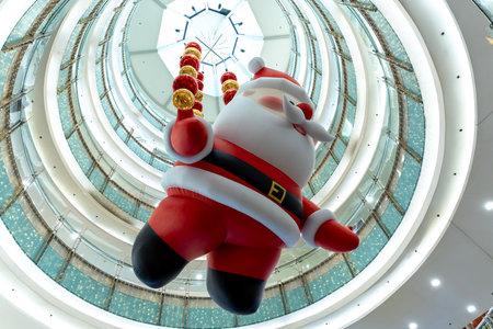 Santa Claus doll and Christmas decorations at a shopping mall in Manila, Philippinesの写真素材