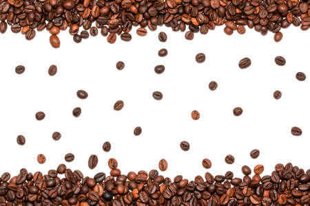 Top view of roasted coffee beans on white backgroundの写真素材