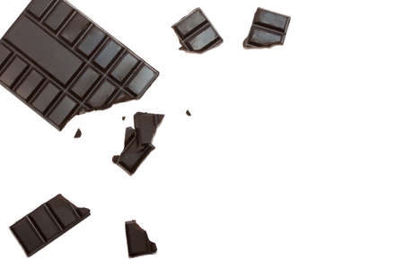 Broken chocolate bar left position isolated on white table. Horizontal composition. Top viewの写真素材