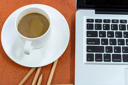 White Coffee Cup on Tableの写真素材