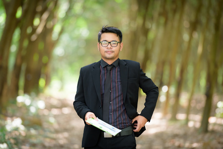Plant researchers are checking latex from rubber trees.の写真素材