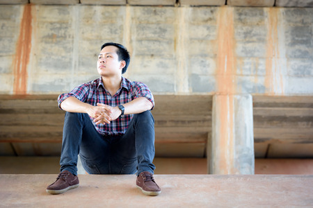 Hipster men backpack are enjoying a tour under a large bridge.の写真素材